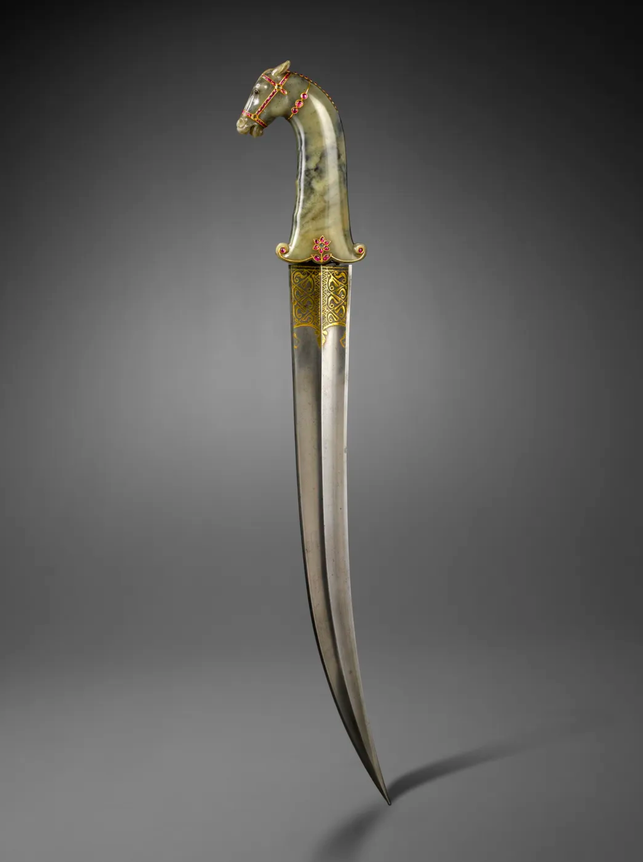 Dagger With Horse Head, Damascus steel with jade, rubies, emeralds and gold, India, Mughal dynasty, 1600-1700 © Musée du Louvre, Dist. GrandPalaisRmn / Hughes Dubois-www.namiraholdingcompany.com 